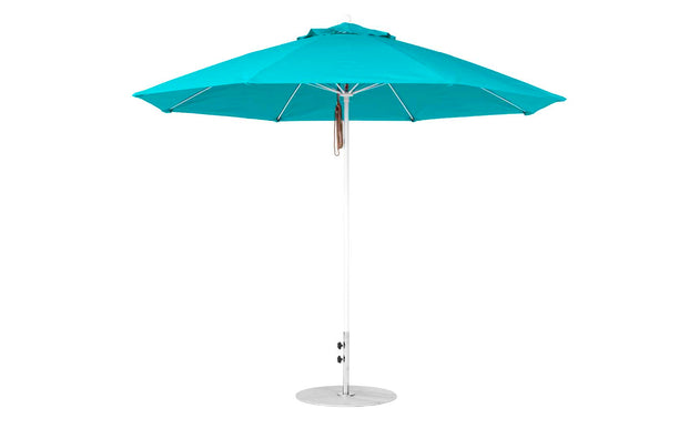 The Essential Fiberglass Umbrella by Ledge Lounger is an 11 octagon turquoise outdoor umbrella with a silver pole and round base. Featuring marine-grade fabrics and eight panels, this wind-resistant canopy ensures enhanced durability.