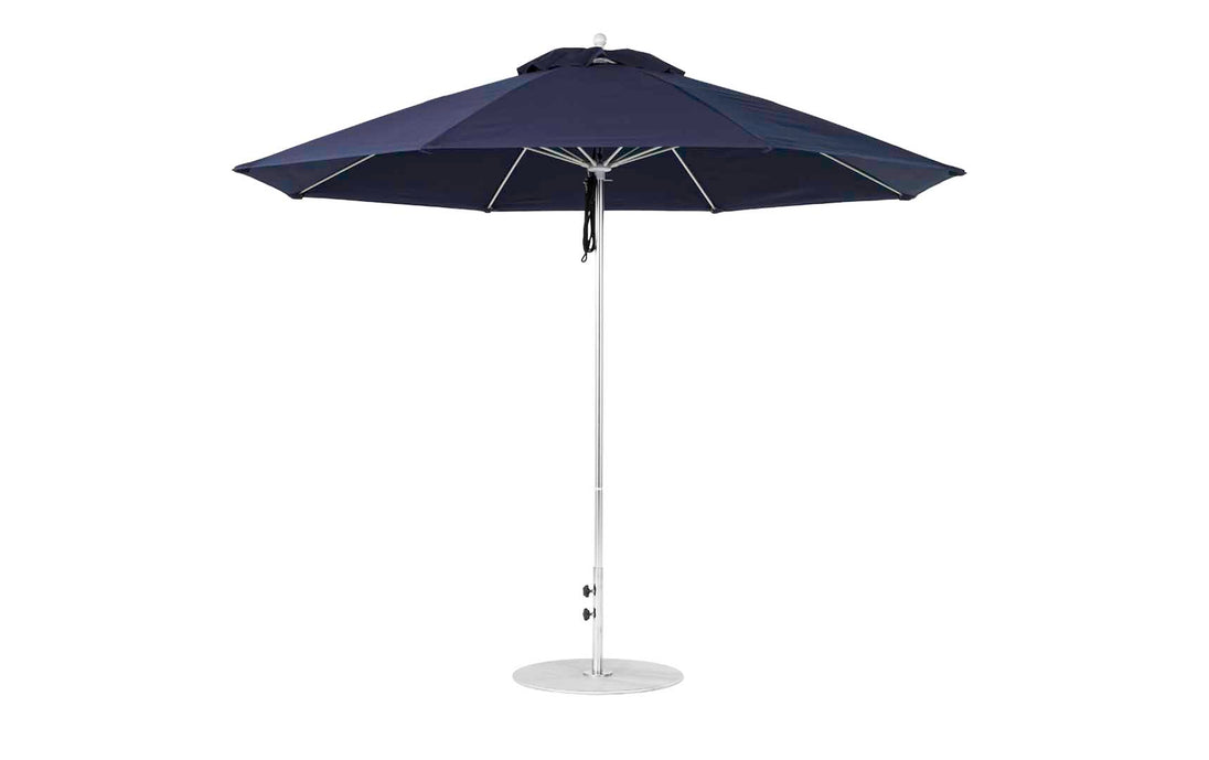 The Ledge Lounger Essential Fiberglass Umbrella features a wide, slightly domed canopy made from marine-grade fabrics. This durable 11 octagon umbrella with a sturdy metal pole stands on a circular base, offering ample shade for any outdoor space.