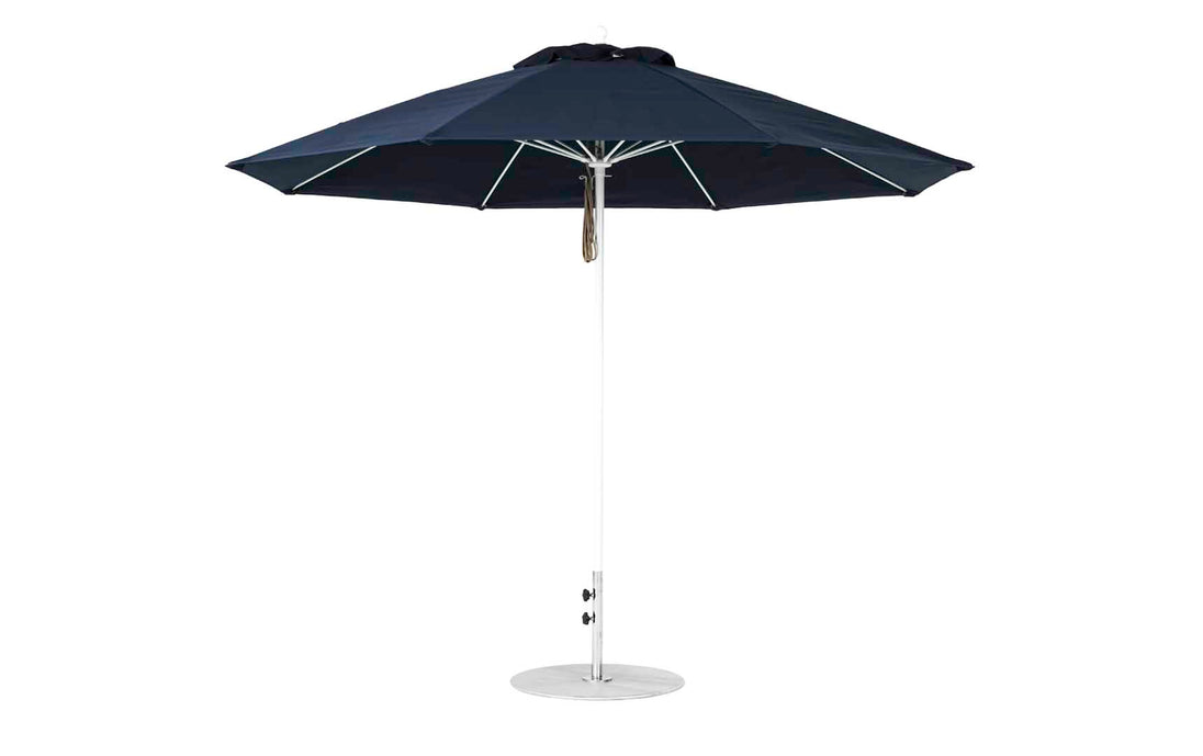 The Essential Fiberglass Umbrella from Ledge Lounger features a black octagon canopy made of marine-grade fabric, a white pole, and a round metal base, all set against a pristine white background.