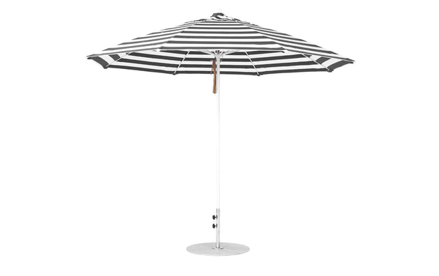 The Ledge Lounger Essential Fiberglass Umbrella features an 11 octagon design with black and white stripes. Wind-resistant and crafted from marine-grade fabrics, this umbrella boasts a metal pole and round base, making it ideal for outdoor settings.