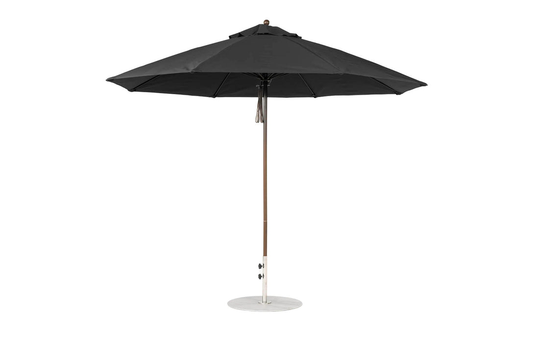 The Ledge Loungers Essential Fiberglass Umbrella features an 11 octagon canopy, black design, marine-grade fabric, a silver pole, and a round white base. This wind-resistant umbrella has a sleek modern look and offers wide coverage when fully opened.