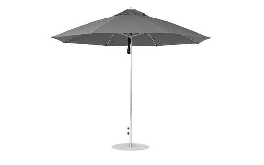 The Essential Fiberglass Umbrella - 11 Octagon Pulley by Ledge Lounger features a grey canopy with marine-grade fabrics, a white metal pole, and is wind-resistant. It stands upright on a round base, perfect for patios or gardens.