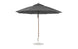 The 11 Octagon Pulley Essential Fiberglass Umbrella by Ledge Lounger stands upright with a wooden pole and metal base. Its sleek, modern design, wind resistance, and marine-grade fabrics make it ideal for any outdoor setting.