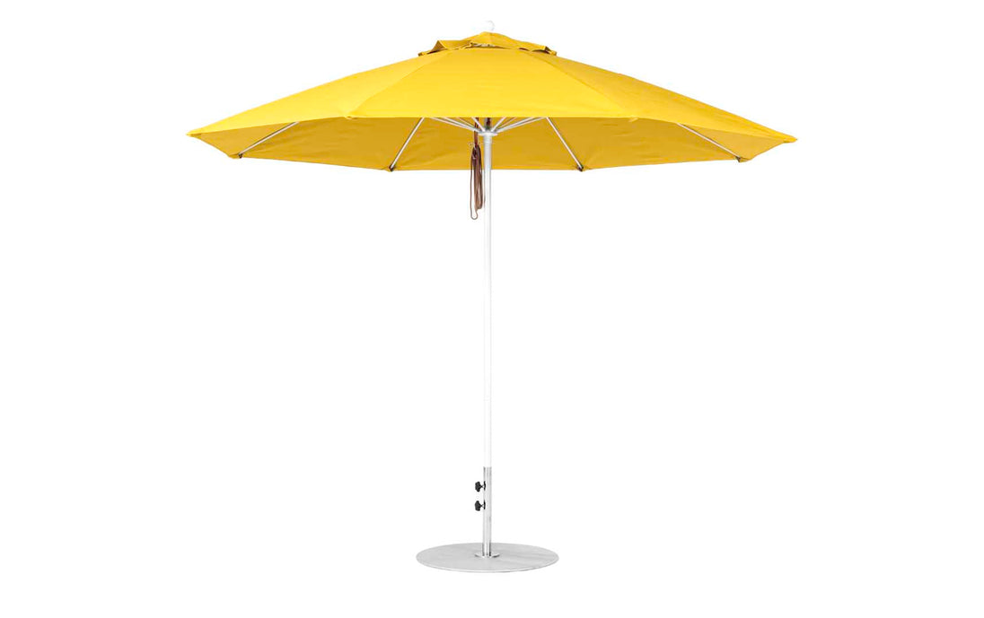 The Essential Fiberglass Umbrella by Ledge Lounger is a fully opened, wind-resistant, large yellow patio umbrella with an 11 octagon canopy, made from marine-grade fabrics. It features a white pole and round metal base against a plain white background.