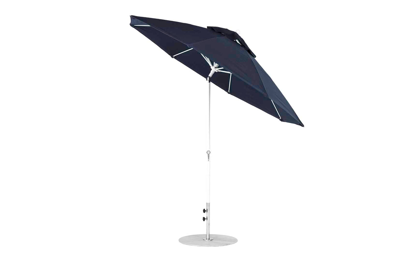 The Ledge Lounger Essential Fiberglass Umbrella - 9 Octagon Crank Auto Tilt is a large, dark blue patio accessory with marine-grade fabric, a silver pole, and a sturdy round base. Its open canopy showcases the resilient rib structure against the elements.