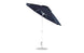 The Ledge Lounger Essential Fiberglass Umbrella - 9 Octagon Crank Auto Tilt is a large, dark blue patio accessory with marine-grade fabric, a silver pole, and a sturdy round base. Its open canopy showcases the resilient rib structure against the elements.