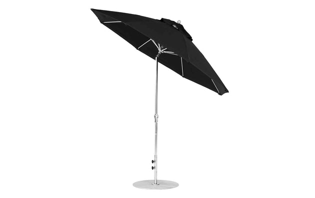 The 9 Octagon Crank Auto Tilt Essential Fiberglass Umbrella by Ledge Lounger features marine-grade fabrics, a shiny metal pole, and round base. Open and slightly tilted to the side, it’s ideal for outdoor use, providing shade and sun protection.