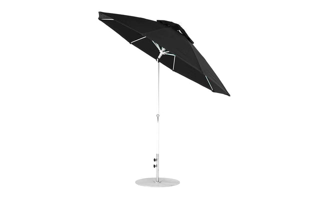 The Ledge Lounger Essential Fiberglass Umbrella features a partially open, modern black design with a sleek silver pole and round metal base. Its marine-grade fabrics make it ideal for patios or gardens, and its equipped with a 9 octagon crank auto tilt.