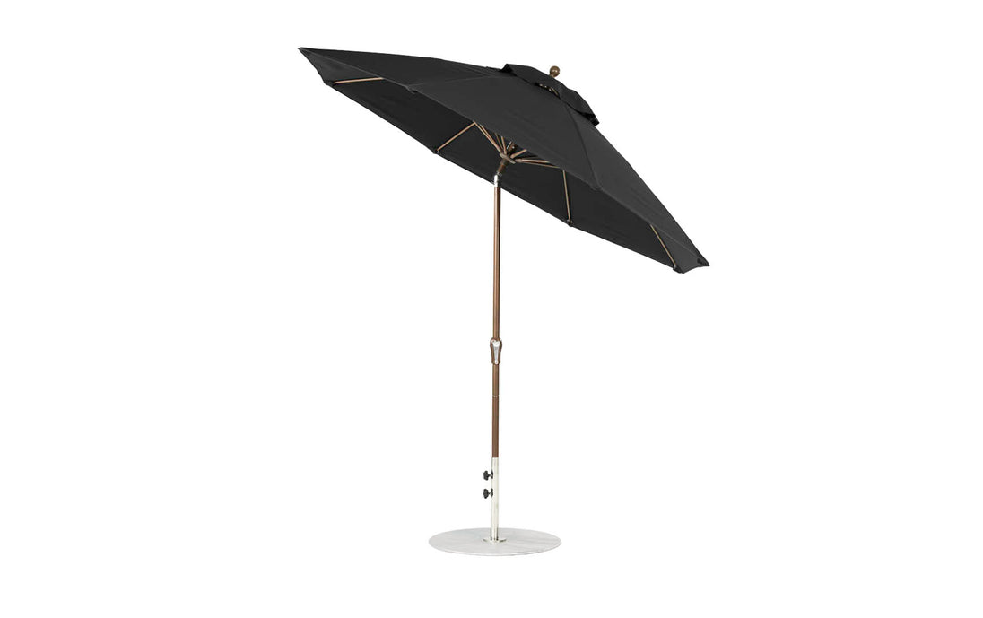 Uncover the Essential Fiberglass Umbrella by Ledge Lounger, boasting a 9 black octagonal canopy made from marine-grade fabrics. Supported by a wooden pole and metal base, it allows for hassle-free angle adjustment with its crank auto-tilt feature, ensuring excellent sun protection.