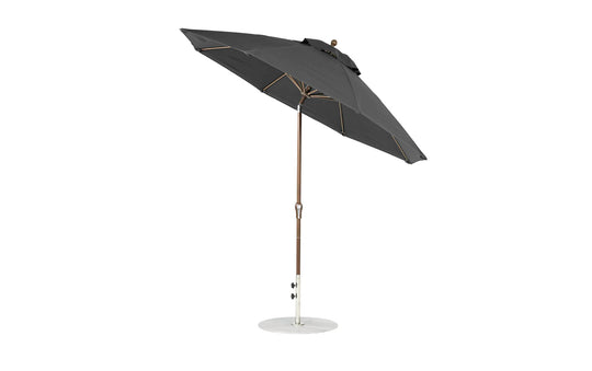 A 9 Octagon Crank Auto Tilt Essential Fiberglass Umbrella by Ledge Lounger features marine-grade fabrics, a black metal pole, and sturdy base. This sleek design includes a tilting mechanism and is displayed against a white background.