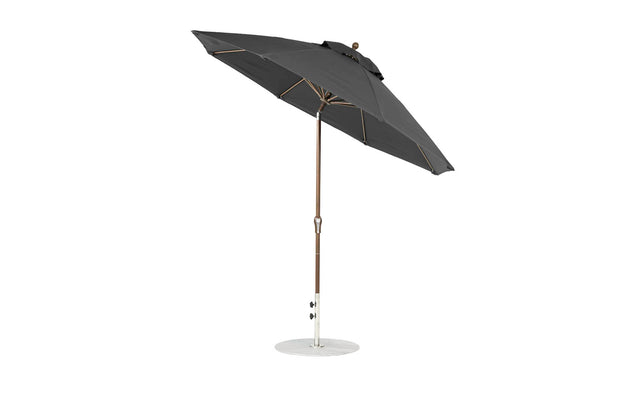A 9 Octagon Crank Auto Tilt Essential Fiberglass Umbrella by Ledge Lounger features marine-grade fabrics, a black metal pole, and sturdy base. This sleek design includes a tilting mechanism and is displayed against a white background.
