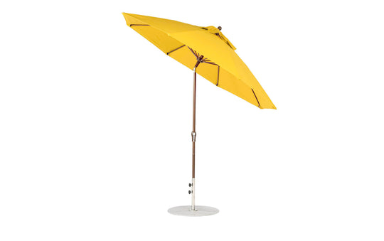 A Ledge Lounger Essential Fiberglass Umbrella, featuring a 9 octagon canopy made from marine-grade fabrics on a metal frame, is fully open with a crank auto tilt mechanism.