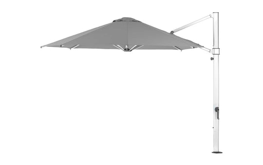 Side view of the Ultra Cantilever Umbrella - 11 Octagon by Ledge Lounger, showcasing a gray octagonal canopy on a white frame with an outdoor light. A vertical pole and crank mechanism support this rechargeable umbrella, enhancing the patio space’s minimalist and modern design.