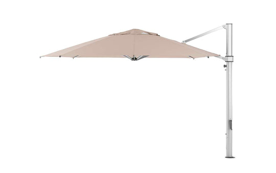 The Ultra Cantilever Umbrella by Ledge Lounger is a modern 13 octagon umbrella in beige with a sturdy silver pole and arm, ideal for your patio. Open, it reveals smooth fabric, perfect for outdoor ambiance. Enhance evening gatherings by adding a rechargeable umbrella light.