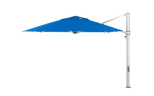 The Ultra Cantilever Umbrella by Ledge Lounger is a 13 octagon with a blue canopy supported on the right by a sleek silver frame. Its perfect for patios and features an integrated rechargeable light to enhance evening ambiance.