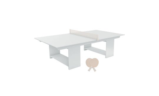 The Ledge Lounger Table Tennis Set offers a minimalist white setup with a central net, ideal for outdoor fun. Two pale wooden paddles and a ball are ready for your next ping pong game, embodying relaxed play in the open air.