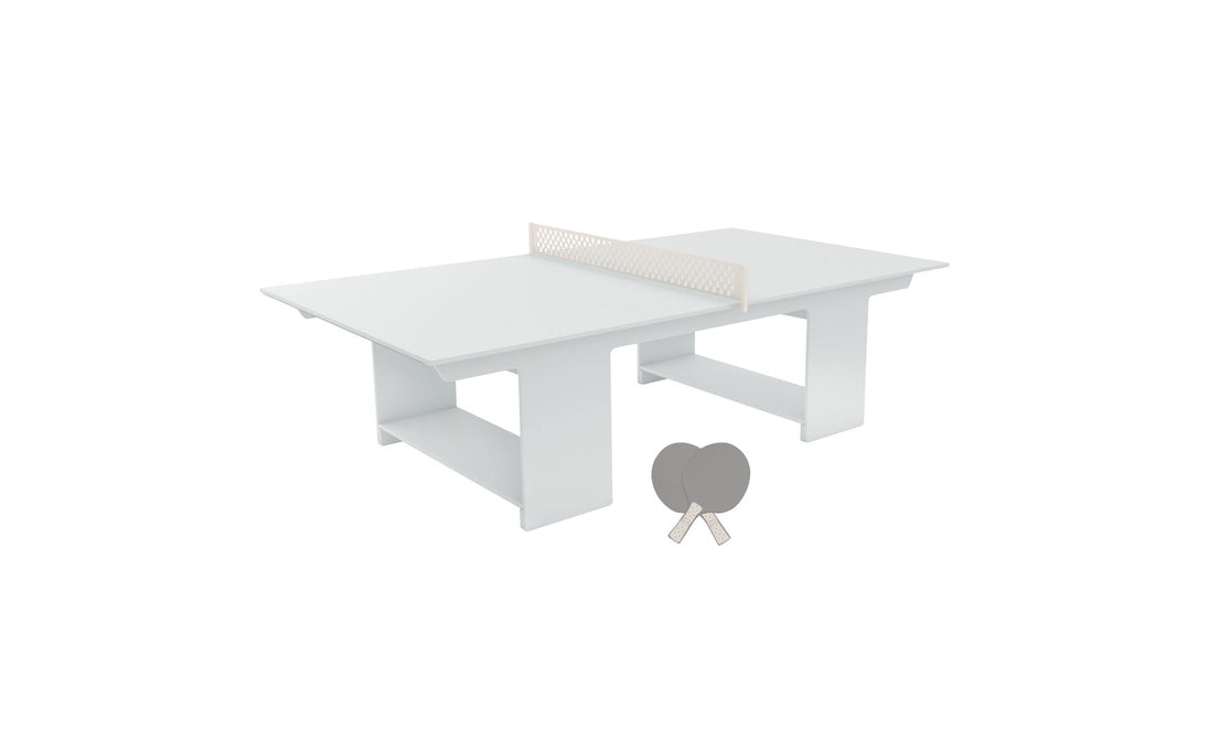 The Ledge Lounger Table Tennis Set, a minimalist white design with a simple net, is perfect for outdoor entertainment. Two sleek paddles complement the clean, modern aesthetic, ideal for any ping pong enthusiast.