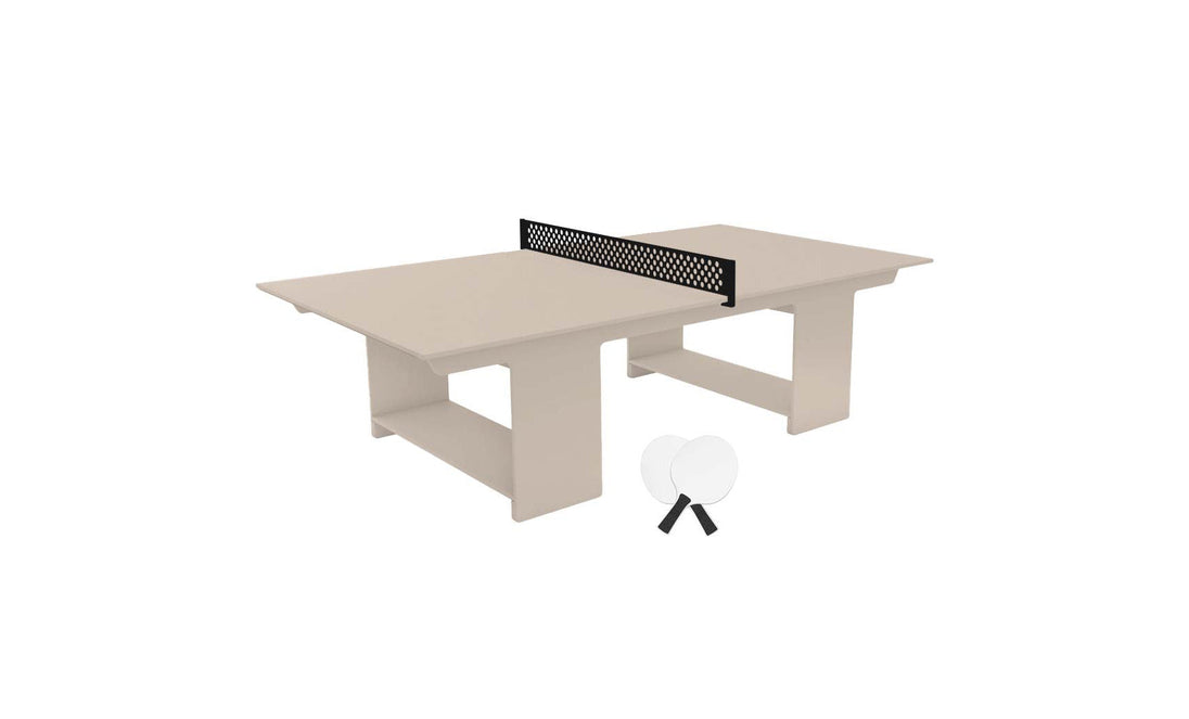 The Ledge Lounger Table Tennis Set, featuring a beige table with a black net and two white paddles with black handles, offers the perfect outdoor entertainment setup for endless fun in the sun.