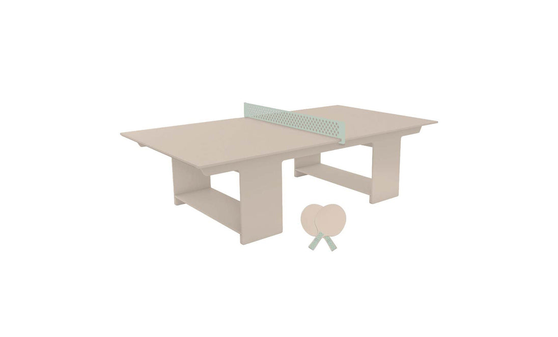 Displayed on a white background, the Ledge Lounger Table Tennis Set features a beige ping pong table with a green net and two crossed beige paddles, offering an ideal solution for outdoor entertainment.
