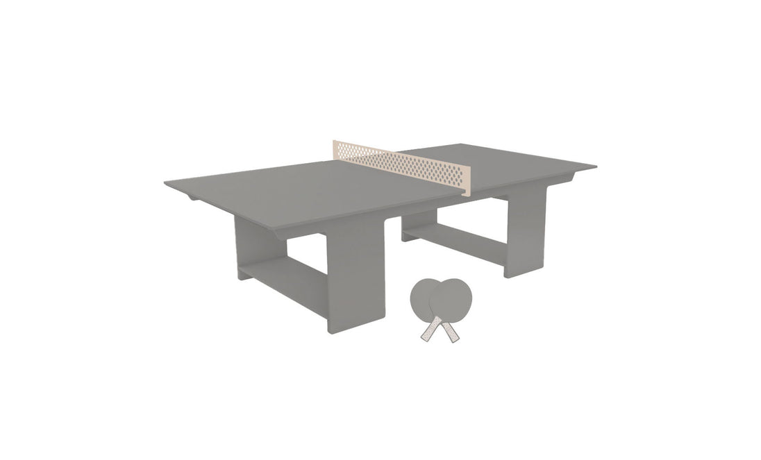 The Ledge Lounger Table Tennis Set features a grey table with a beige net, sleek design, and sturdy legs for outdoor entertainment. It includes two grey paddles and a ball, perfect for lively ping pong matches.