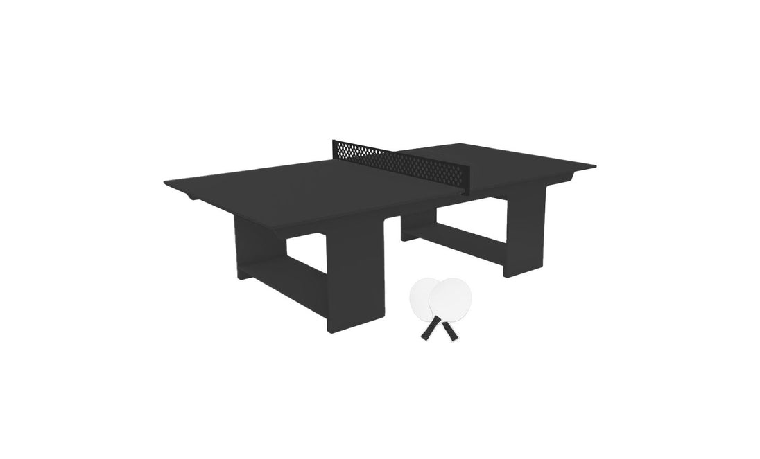 The Ledge Lounger Table Tennis Set is ready for outdoor fun, featuring a black table with a center net. Two white paddles and ping pong balls lean against its legs, creating a striking contrast against the plain white background.
