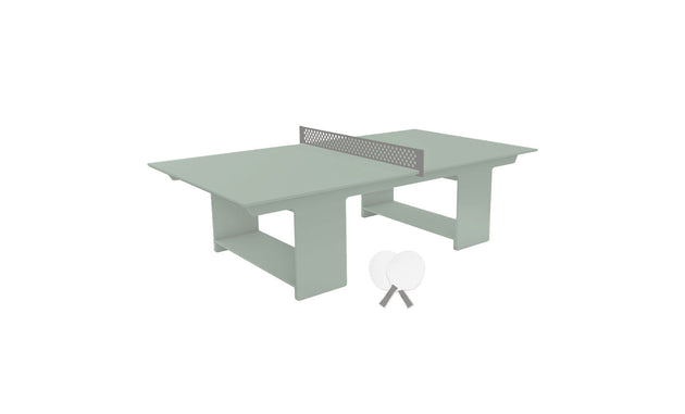This minimalist Ledge Lounger Table Tennis Set is an outdoor entertainment delight, featuring a light green table with a central net, two white paddles leaning together, and two white ping pong balls ready for action.