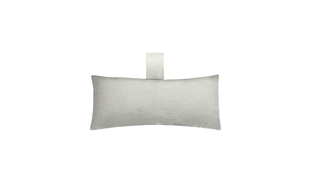The Autograph Headrest Pillow by Ledge Lounger is rectangular and light gray, featuring a small top-center loop made from marine-grade fabric, ideal for in-pool relaxation.