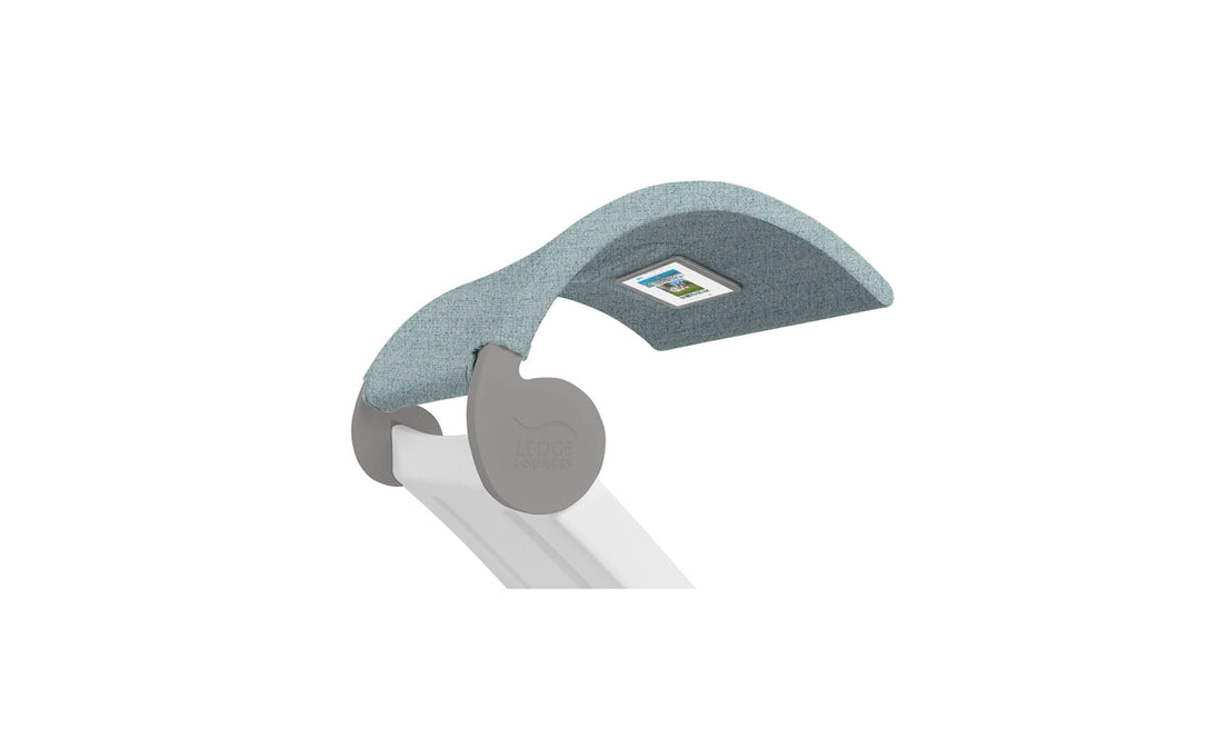 Close-up of a modern light fixture with a curved teal shade resembling the Signature Chaise Shade by Ledge Lounger, featuring sleek gray accents and a white base for a contemporary design.