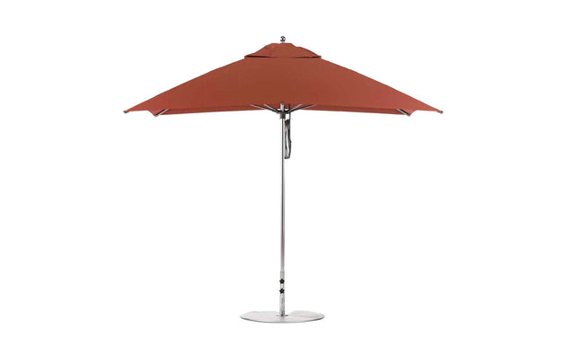 The Ledge Lounger Essential Fiberglass Umbrella - 8.5 Rectangle Pulley features marine-grade red fabric, a silver pole, and a circular base, showcased against a plain white background.