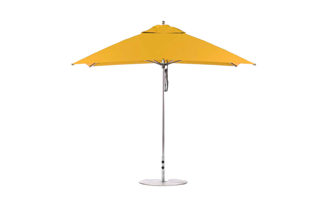 The Ledge Lounger Essential Fiberglass Umbrella features a marine-grade, corrosion-resistant yellow rectangular canopy supported by a sleek silver pole and base. Its modern design offers wide coverage suitable for any outdoor space and is enhanced with an 8.5 rectangle pulley system.