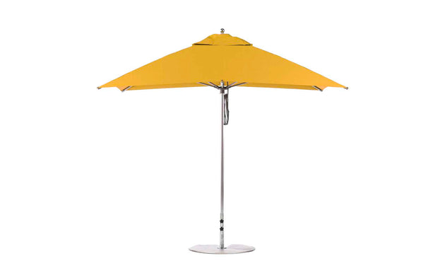 The Ledge Lounger Essential Fiberglass Umbrella features a marine-grade, corrosion-resistant yellow rectangular canopy supported by a sleek silver pole and base. Its modern design offers wide coverage suitable for any outdoor space and is enhanced with an 8.5 rectangle pulley system.