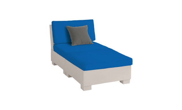 The Ledge Lounger Signature Sectional 2 Piece Sun Chair offers ultimate relaxation with its white frame, blue cushions, and gray pillow, crafted from durable materials.