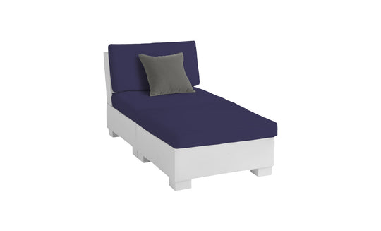 The Ledge Lounger Signature Sectional 2 Piece Sun Chair features a durable white design with navy blue cushions and a small grey throw pillow, offering the ultimate relaxation experience against a plain white background.
