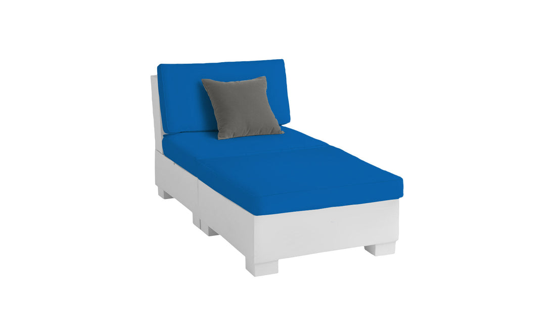 The Signature Sectional 2 Piece Sun Chair by Ledge Lounger is a white chaise lounge made with durable materials, featuring thick blue cushions and a single gray pillow. Its modern, simplistic design emphasizes clean lines for an unparalleled relaxation experience.