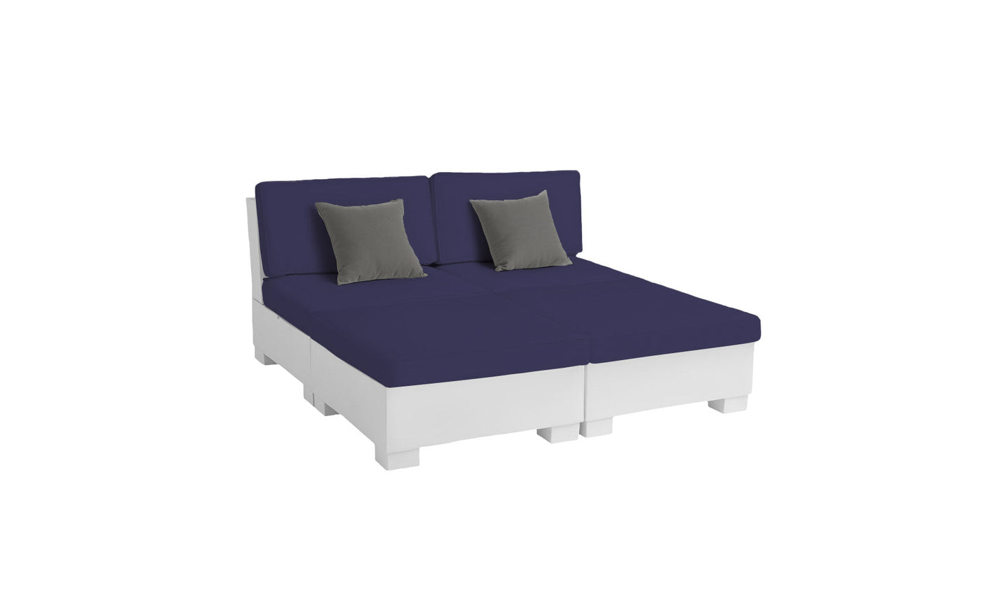 The Signature Sectional 4 Piece Sun Chair by Ledge Lounger features a white modular pallet sofa with navy blue cushions and two gray throw pillows. Ideal for relaxation, it can be configured into a spacious seating area or a bed-like setup against a white backdrop.