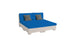 The Signature Sectional 4 Piece Sun Chair by Ledge Lounger features spacious seating with blue cushions, two gray pillows, and a light-colored base. This modular outdoor set is perfect for sun relaxation and is showcased on a plain white background.