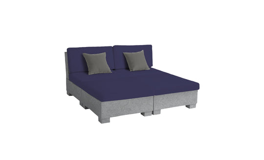 The Signature Sectional 4 Piece Sun Chair by Ledge Lounger exudes relaxation with its modern design. A navy blue cover pairs with dark grey cushions, while a light grey base adds a sleek touch. Set against a white background, it offers spacious seating and contemporary comfort.
