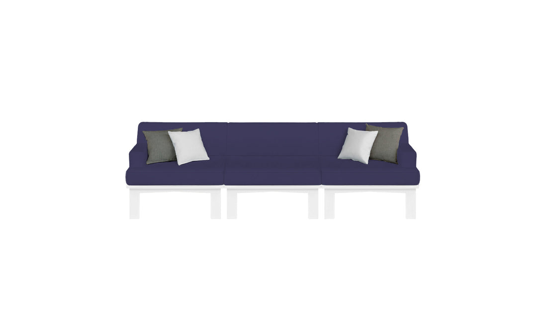 The Mainstay Sectional 3 Piece Sofa by Ledge Lounger is a long, dark blue sectional with three sections and white legs. It features two white and two dark gray throw pillows symmetrically placed against a plain white background.
