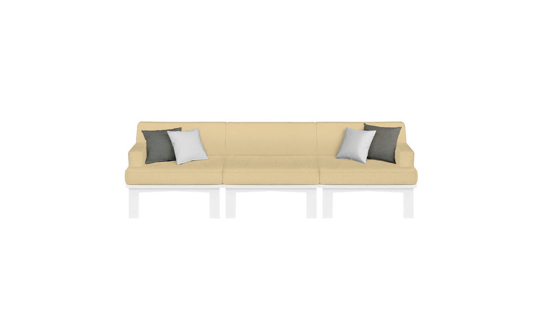 The Mainstay Sectional 3 Piece Sofa by Ledge Lounger is a modern beige three-seater with white metal legs. It includes four throw pillows—two dark gray and two white—symmetrically arranged, completing an elegant look against a plain white backdrop.