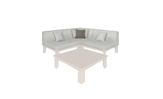 The Mainstay Sectional 4 Piece Diamond by Ledge Lounger, an L-shaped light-colored sofa with four cushions, is cozily nestled in a corner. A matching square coffee table sits in front. The sofa includes two light gray pillows and one dark gray pillow for an inviting space.