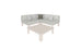 The Mainstay Sectional 4 Piece Diamond by Ledge Lounger, an L-shaped light-colored sofa with four cushions, is cozily nestled in a corner. A matching square coffee table sits in front. The sofa includes two light gray pillows and one dark gray pillow for an inviting space.