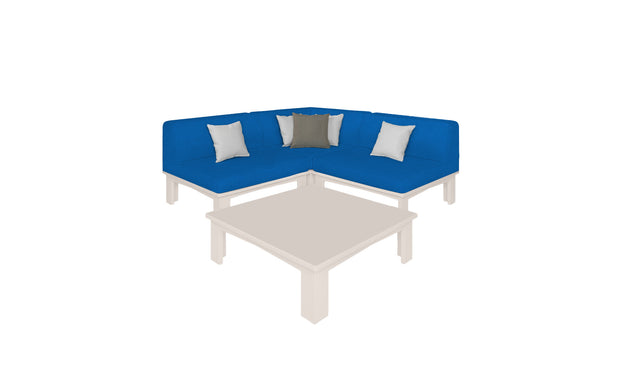 The Mainstay Sectional 4 Piece Diamond by Ledge Lounger, featuring blue fabric with metal legs and four cushions, forms a cozy corner around a square beige coffee table with matching metal legs.