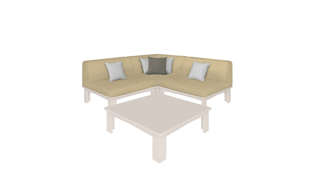 The Mainstay Sectional 4 Piece Diamond by Ledge Lounger forms an inviting L-shaped corner with five square pillows—three light gray and two dark gray. It encircles a beige square coffee table, all set against a simple white backdrop.