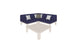 The Mainstay Sectional 4 Piece Diamond by Ledge Lounger features a modern L-shaped design in navy blue, complemented by white and gray cushions. It creates a cozy corner with a square beige coffee table, all stylishly isolated on a white background.