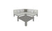 The Mainstay Sectional 4 Piece Diamond by Ledge Lounger in gray forms a cozy corner with two white and one dark gray cushion against a blank background, complemented by a matching rectangular coffee table for an inviting setup.