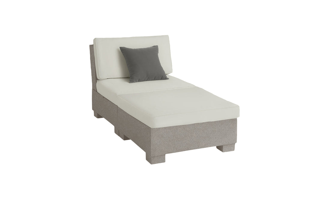 The Signature Sectional 2 Piece Sun Chair by Ledge Lounger is a modern, light gray chaise lounge crafted from durable materials with soft cushions and a dark gray throw pillow, set against a plain white background for an elevated relaxation experience.