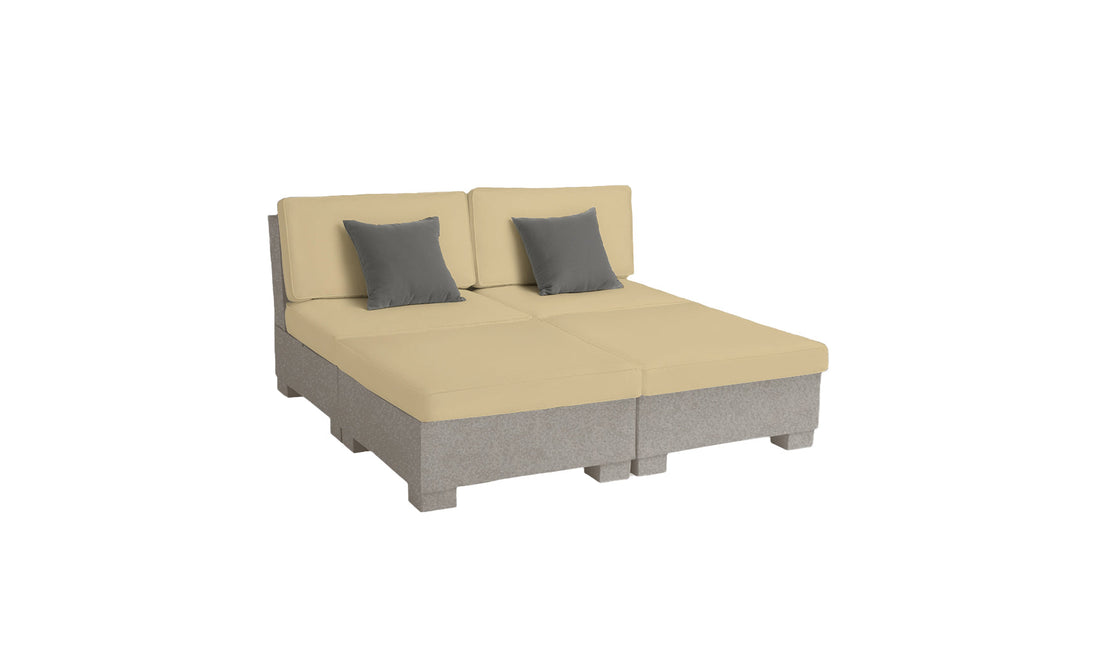 The Signature Sectional 4 Piece Sun Chair by Ledge Lounger offers a beige modular sofa with spacious seating, including two seat cushions, two back cushions, and gray accent pillows on a light gray base. Its low-profile and contemporary design brings relaxation and modern comfort to any living space.