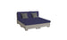 The modern low-profile double bed boasts a gray base with navy bedding and matching gray pillows. Set against a plain white background, its minimalist design mirrors the sleek, contemporary style of Ledge Loungers Signature Sectional 4 Piece Sun Chair, offering comparable relaxation.