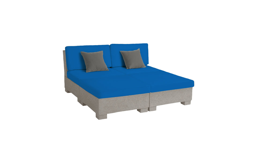 The Signature Sectional 4 Piece Sun Chair by Ledge Lounger features a spacious modular design with blue cushions, two gray accent pillows, and a light gray base. Its modern blocky style ensures both relaxation and durability, transforming any room into a sanctuary.