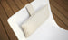 The Autograph Headrest Pillow from Ledge Lounger is a final sale item featuring a white cushion with beige and white stripes, designed to attach securely to a chair backrest via a loop.